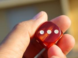 Dobbelsteen in de hand