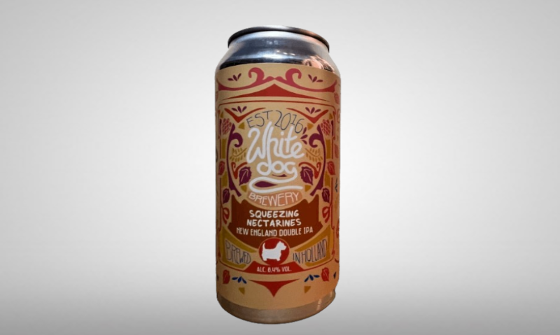 White Dog Squeezing Nectarines