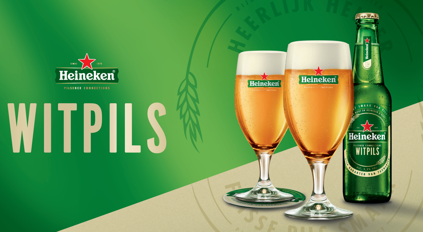 Helder glas Heineken witpils met schuimkraag en logo.
