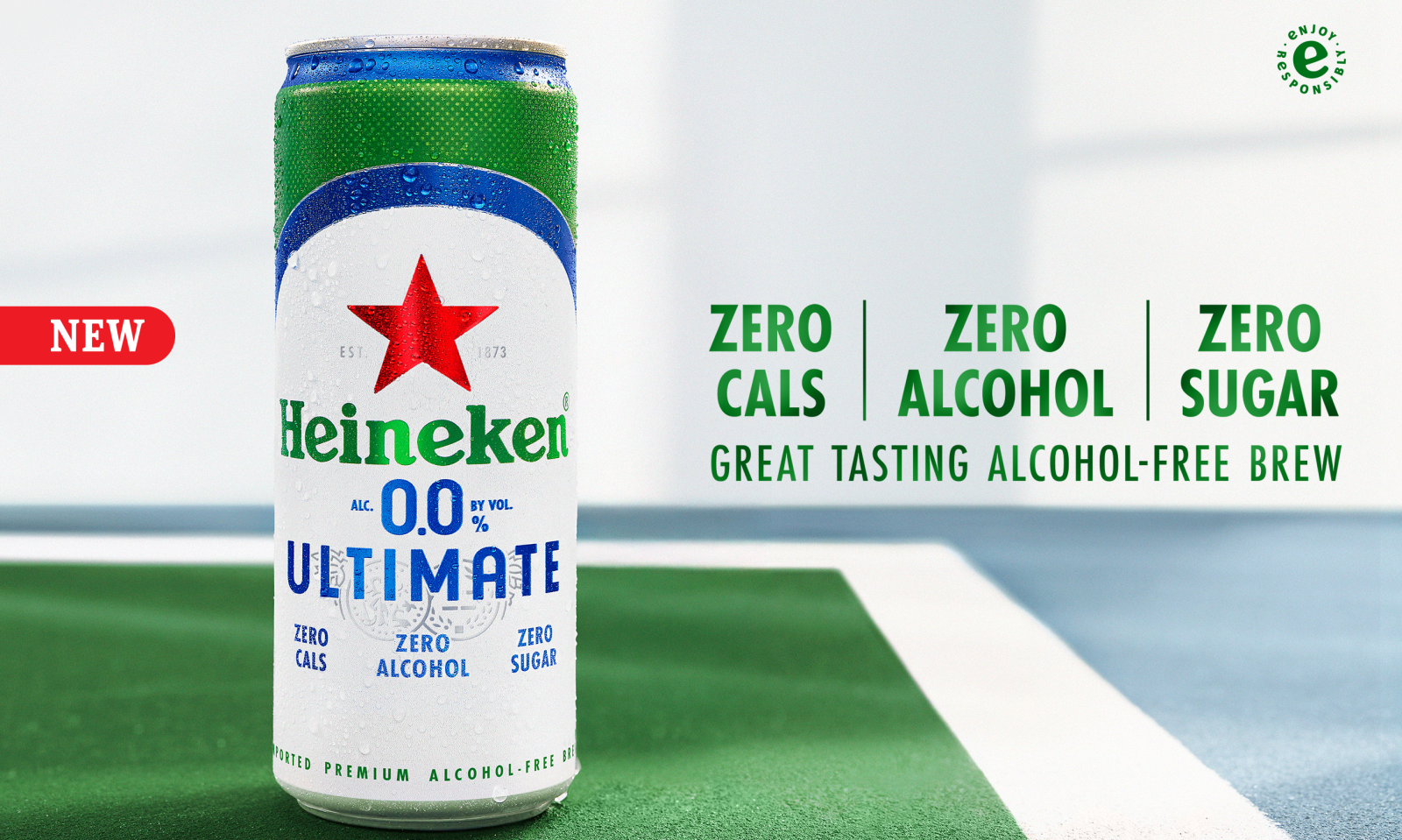 Heineken 0.0 Ultimate blikje op een groen oppervlak met tekst over nul calorieën, alcohol en suiker.