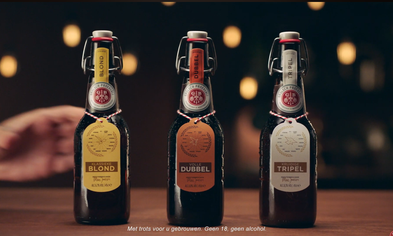 Drie Grolsch Proeverijbieren op een rij met labels: Blond, Dubbel en Tripel.